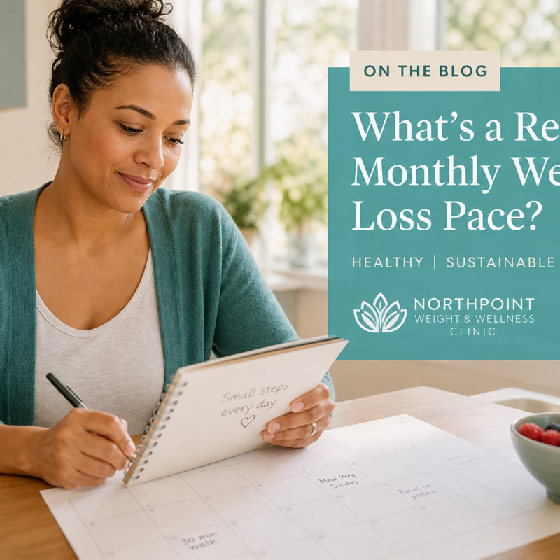 Person reviewing a weekly health plan in a bright kitchen, representing a realistic monthly weight loss pace